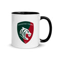 White ceramic mug with black handle and interior and a green, red and white Leicester Tigers logo.