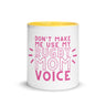 White ceramic mug with yellow interior and a pink 'don't make me use my rugby mom voice' inscription.