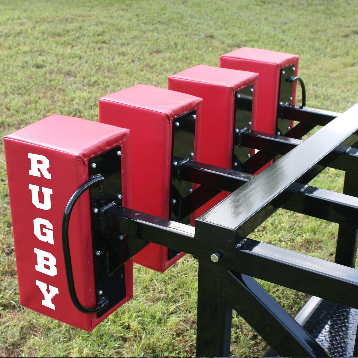 Side View of Red Foam Pads Mounted to Black Steel Scrum Sled