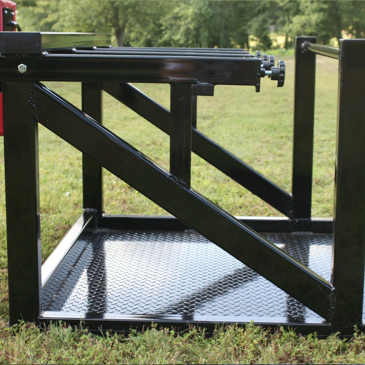 Side View of Tension Adjustment Knobs and Black Steel Platform