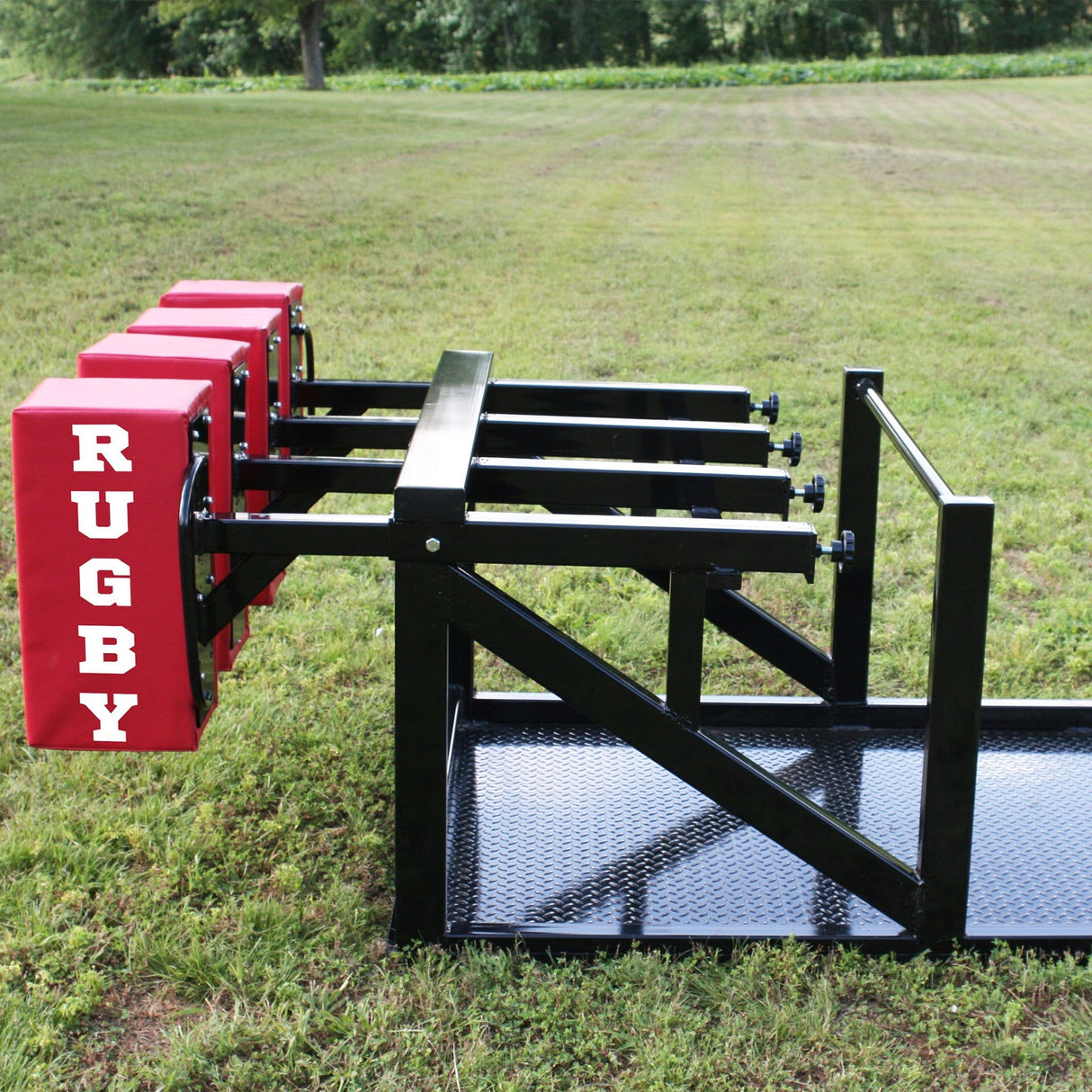 Side View of Red Foam Pads on Large Black Steel Scrum Sled
