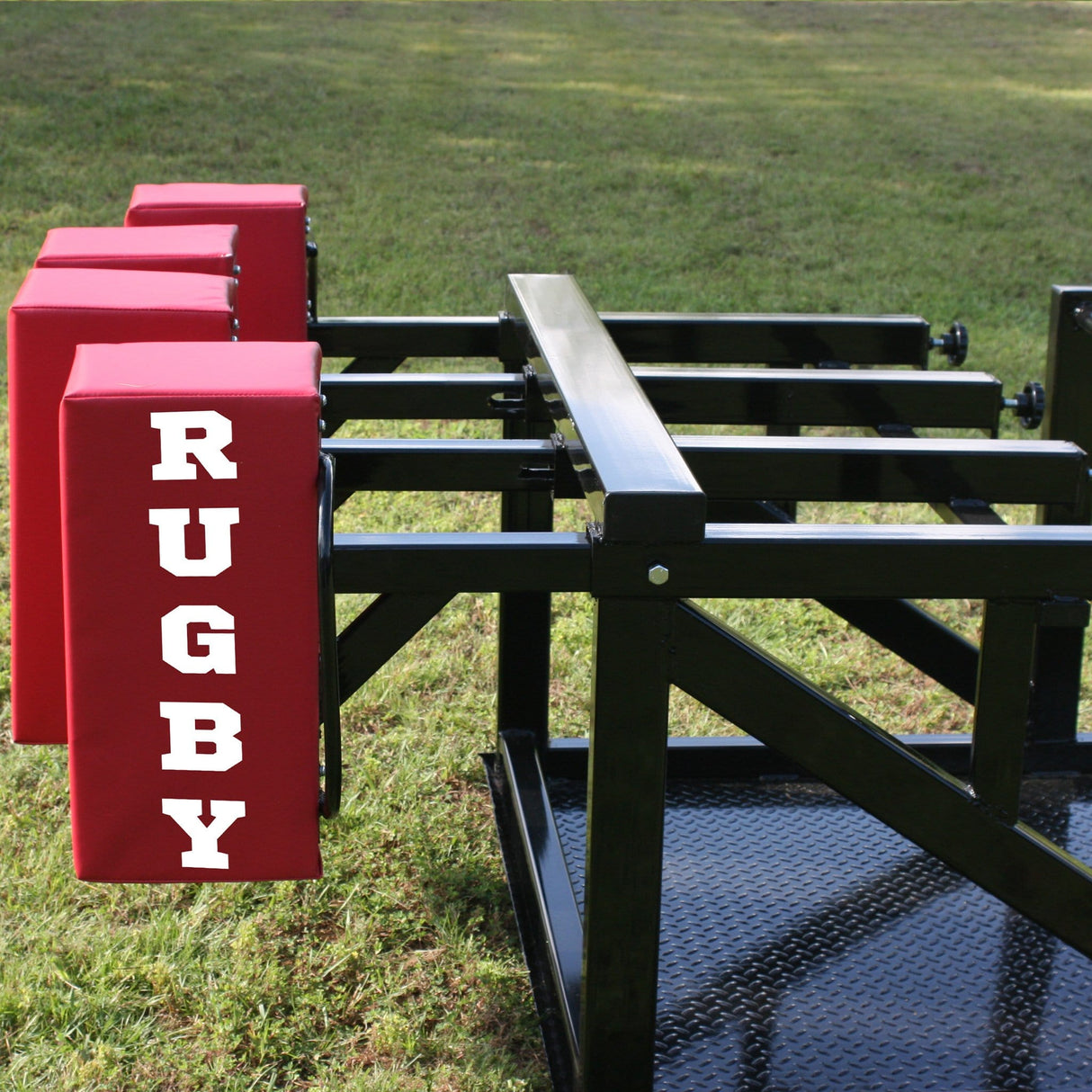 Side View of Black Steel Scrum Sled With Red Foam Pads