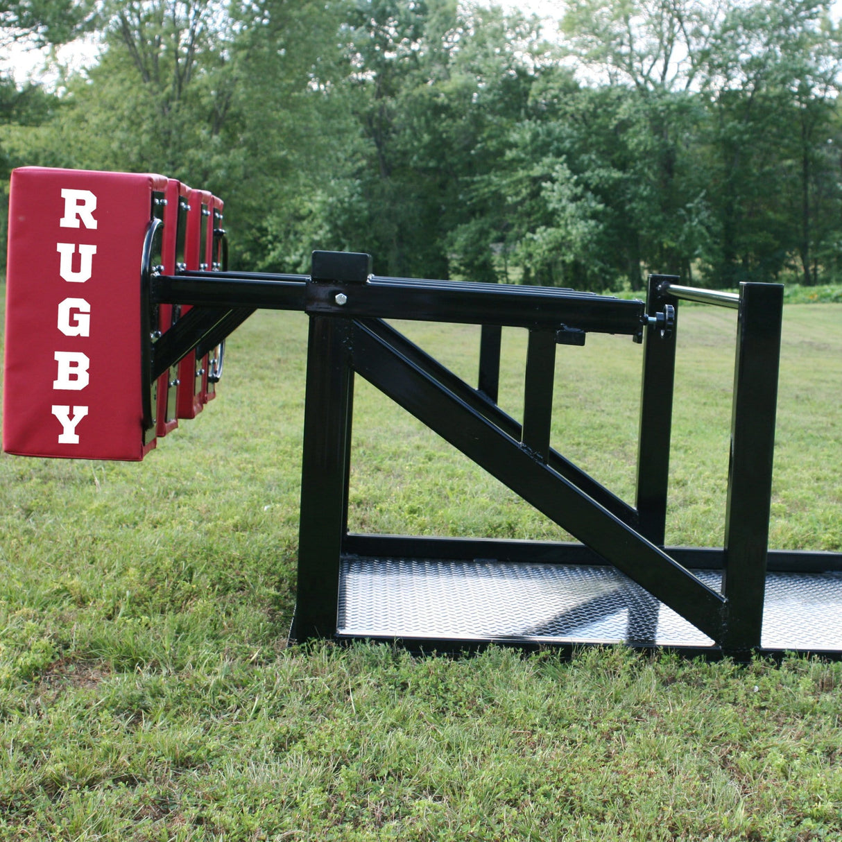 Side View of Red Foam Pads Mounted Onto Large Black Steel Sled